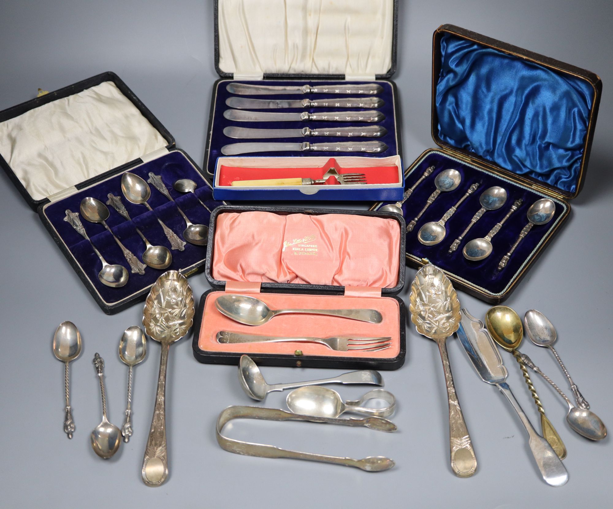 Small silver - 2 berry spoons, butter knife, ladle, feeder, christening spoon and fork. Two cased sets, tongs and a silver gilt spoon